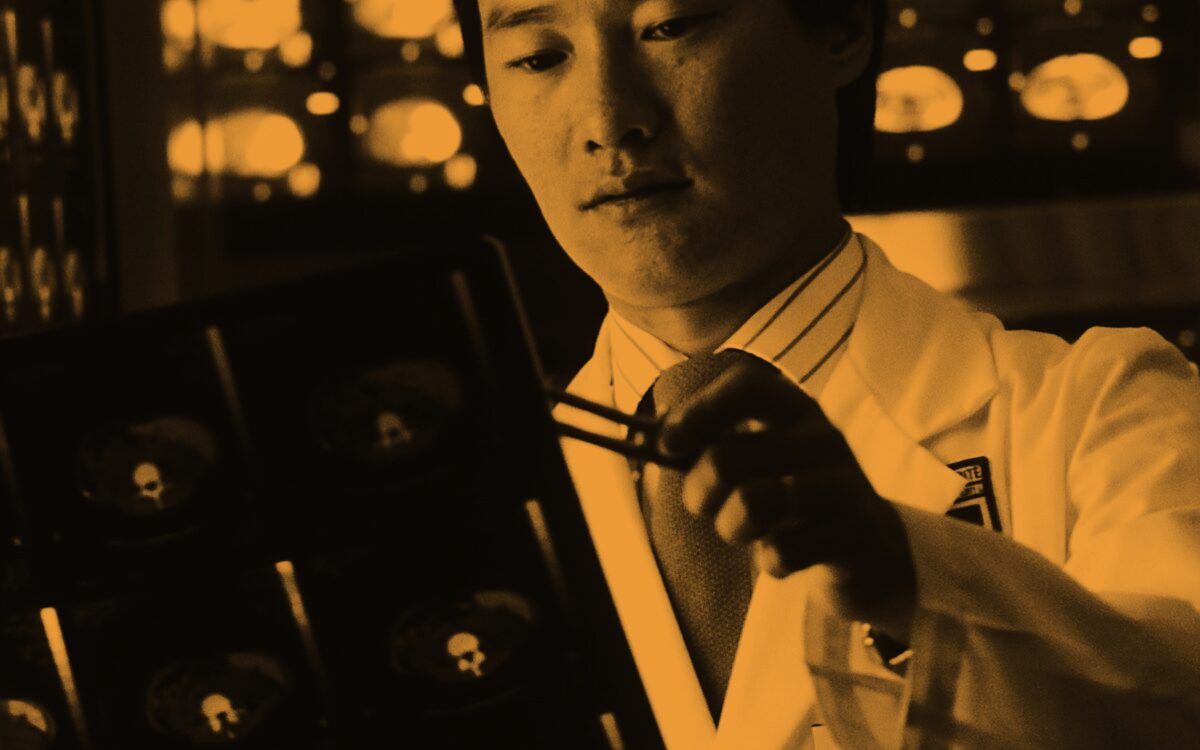 A radiologist reading scan films on a lightbox