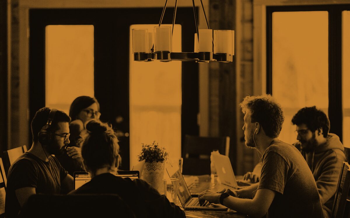 A hiring panel deliberating around a table